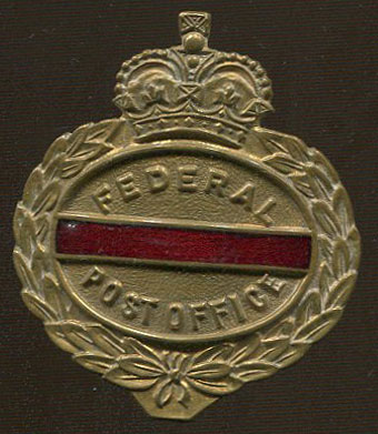 1953-63 Rhodesia & Nyasaland Federation Postman's cap badge in brass and enamel. 4 x 4.5cm